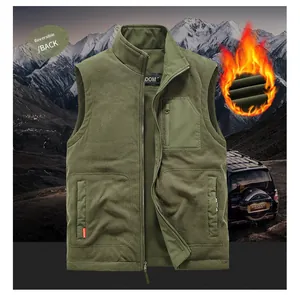 Detail of reversible military green fleece vest with zipper pockets for outdoor warmth