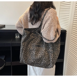 Leopard print tote bag shown from a back view on model for daily casual style