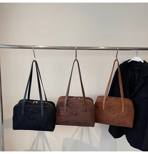 Three colors of suede tote bags displayed showing vintage brown, black, and tan finishes