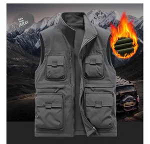 Detail of dark gray outdoor vest showing multi-pockets and warm fleece lining texture