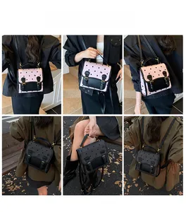 Polka dot backpack for women shown in pink and black being worn outdoors by a model