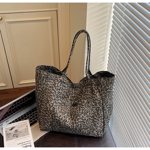 Detail of leopard print tote bag with thick fabric texture in a lifestyle home setting