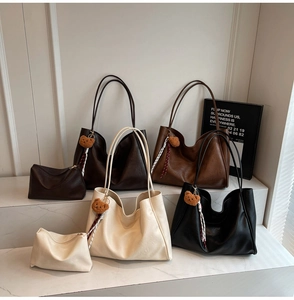 Detailed view of luxury tote bags in four colors with soft PU leather and bear charms