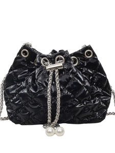 Fashionable black quilted bucket bag with silver chain and white pearl accents on white background