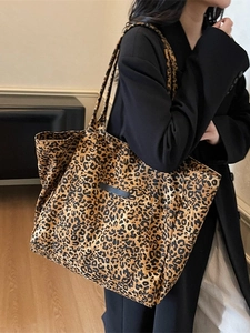 Large leopard print tote bag with outer pocket and canvas texture for women commuting
