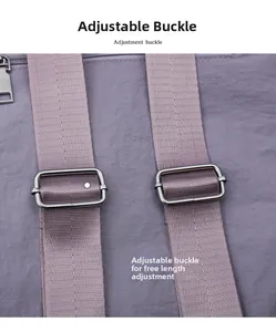 Detail of adjustable nylon shoulder straps with silver metal buckles on a purple tote bag