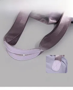 Detail of reinforced purple tote bag handles with soft leather grip and cross stitching