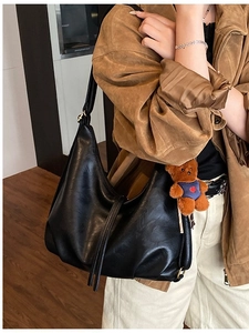 Vintage large black PU leather dumpling bag with fringe and plush bear pendant