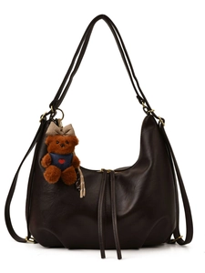 Vintage dark brown leather crescent bag with shoulder straps and cute teddy bear charm