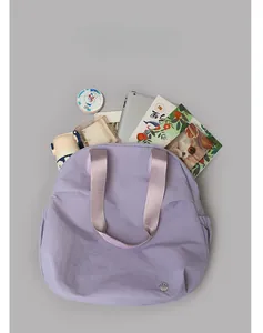 Detailed top view of large lavender tote bag showing spacious capacity for tablets and books