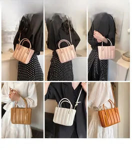 Vertical pleated soft leather tote bag shown in pink, beige, and caramel on a model