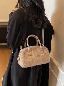 Chic light brown faux fur handbag with plush texture and leather handles for autumn