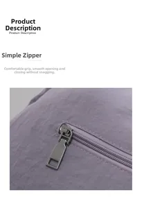 Detailed macro view of the silver metal zipper on lavender nylon tote bag fabric