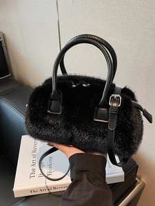 Furry black faux fur handbag with leather handle and silver metal strap for winter fashion
