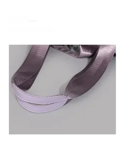 Detail of the purple reinforced tote bag handle with sturdy stitching and nylon webbing