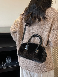 Fuzzy black faux fur Boston handbag with leather handles and detachable shoulder strap