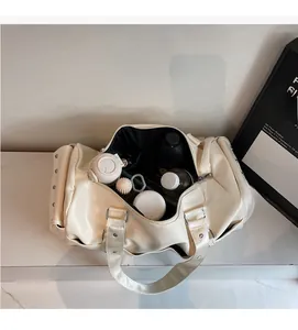 Spacious interior of a cream faux leather travel bag showing organized storage space