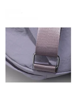 Detail of lavender wrinkled nylon fabric with silver metal ring and durable strap
