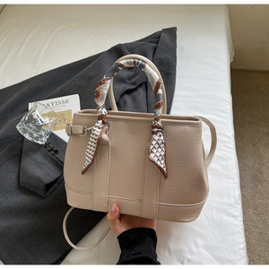 Litchi pattern leather bucket bag with decorative silk scarf on handle and shoulder strap