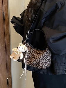 Minimalist leopard print handbag for women with plush bear charm and crossbody strap