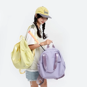 Spacious sports backpack with badminton racket storage in yellow and purple shades