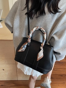 Chic black litchi grain leather bucket bag with silk scarf handle and shoulder strap