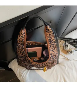 Detailed interior of the leopard print canvas tote bag showing large storage capacity