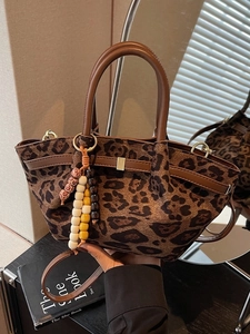 Retro leopard print bucket tote bag with leather handles and decorative wooden beads