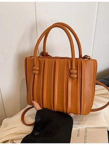 Chic caramel pleated bucket bag for women with bead handle detail and shoulder strap