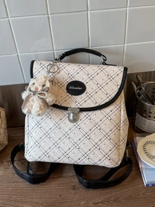 Plaid canvas backpack for women with a minimalist checkered pattern and plush bunny charm