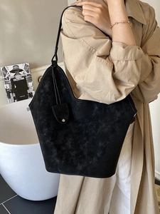 Vintage black suede large tote bag for women showing a stylish shoulder commute style