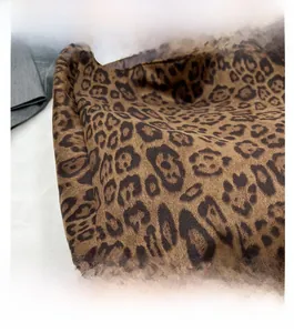 Close-up of leopard print suede texture and premium stitching details on this tote bag