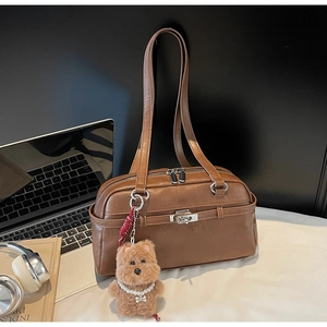 Brown vintage faux leather bowling handbag with cute teddy bear charm and silver hardware