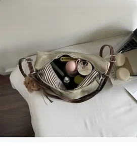Top view of canvas tote interior showing spacious storage for umbrella and makeup