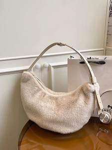 Fuzzy cream crescent hobo bag with adjustable leather strap and silver metal hardware