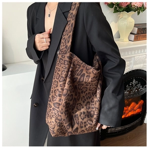 Spacious leopard print tote bag styled with a black blazer for a chic autumn work outfit