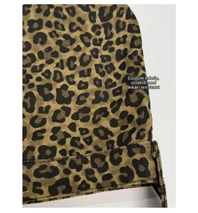 Detail of scratch-resistant leopard print canvas fabric showing durable woven texture