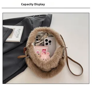 Macro shot of brown faux fur bucket bag showing interior space for phones and wallet