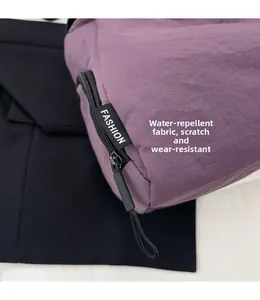 Detailed shot of waterproof purple nylon bag with scratch-resistant texture and zipper