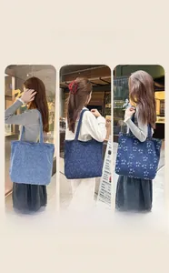 Three washed denim tote bags featuring heart and star patterns in street style settings