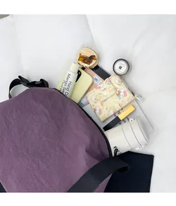 Top view of large capacity purple nylon tote bag showing organized interior storage