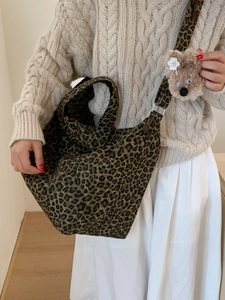 Large leopard print canvas tote bag with wide strap and cute plush bear charm
