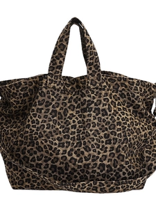 Large leopard print canvas tote bag with dual handles and shoulder strap on white background