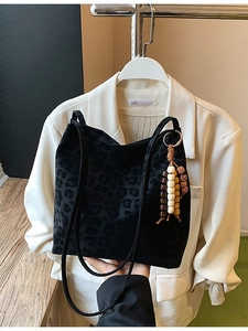 Vintage leopard pattern black suede bucket bag with stylish wooden bead tassels