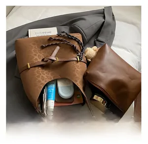 Detailed interior of a brown leopard print tote bag showing large capacity for essentials