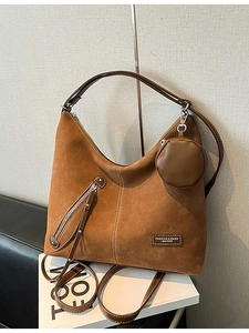 Brown frosted suede hobo bag with contrast stitching and small round coin purse charm