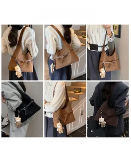 Detailed views of leopard print tote bag with plush bear charm and silk scarf decoration