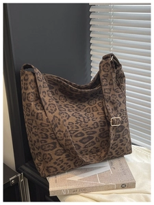 Detail shot of vintage leopard print hobo bag with adjustable wide shoulder strap