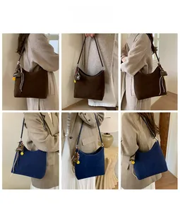 Detailed views of vintage faux suede tote bags in dark coffee and navy blue finishes