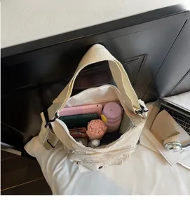 Macro shot of off-white canvas tote interior with large capacity for tablets and daily items
